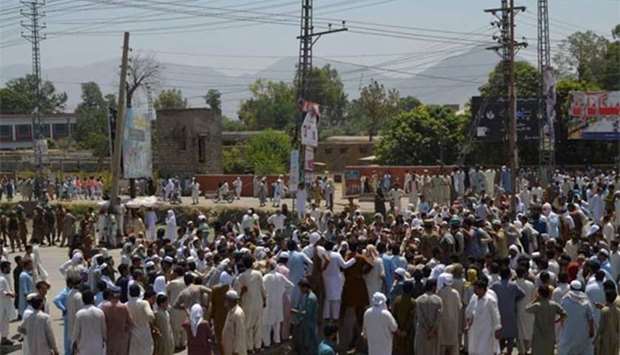 Pakistani protesters gather near a power station during a demonstration against power cuts in the Dargai area of Malakand district on Monday.