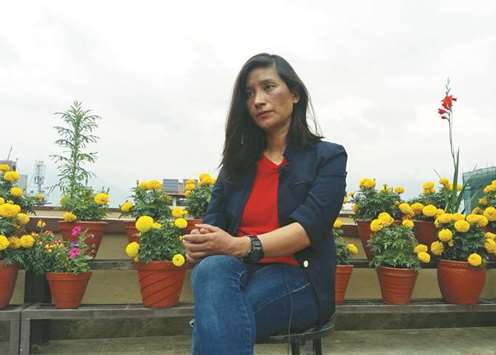 Anshu Jamsenpa, who climbed Everest twice in five days, attends her interview at a hotel in Kathmandu.