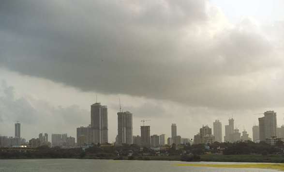 Dark clouds gather over the skyline in Mumbai yesterday as the monsoon season approaches.