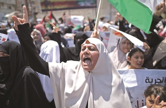 Palestinians take part in a protest against the blockade in Gaza City yesterday, demanding an end to the one-decade-old Israeli siege on Palestinian territory.