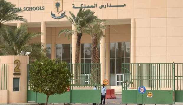 A security guard is standing at the main entrance of the Kingdom school in Riyadh on Wednesday.