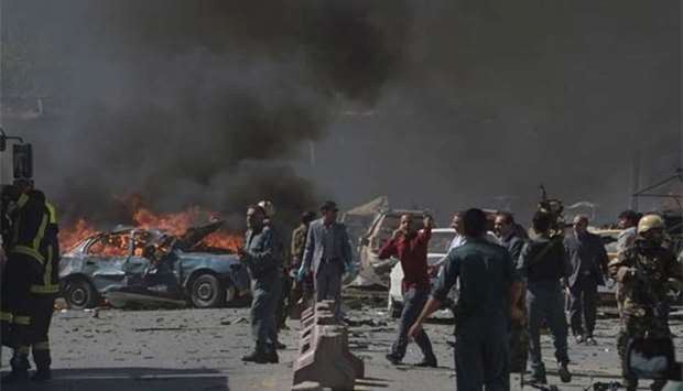 Afghan security forces are seen at the site of a car bomb attack in Kabul on Wednesday.