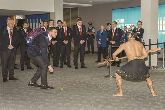 British and Irish Lions captain Sam Warburton (left) accepts the challenge and picks up the dart as he and the rest of the squad receive a traditional Maori welcome upon their arrival at the airport in Auckland yesterday. (AFP)