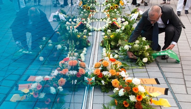 A visitor laying a wreath at the Memorial for the victims of Nazi euthanasia in Berlin during its official inauguration. File photo, September 02, 2014.