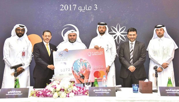 Barwa Bank and Qatar Charity officials at the launch of co-branded card.