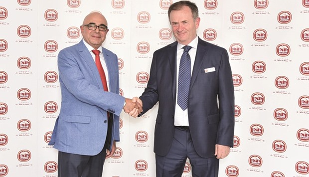 Nabil Mourad, left, and John Dore shaking hands after announcing the partnership (supplied picture).