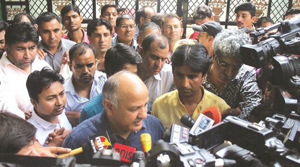 Delhi Deputy Chief Minister and AAP leader Manish Sisodia and party leader Kumar Vishwas speak to reporters after the partyu2019s PAC meeting outside Chief Minister Arvind Kejriwalu2019s residence in New Delhi yesterday.