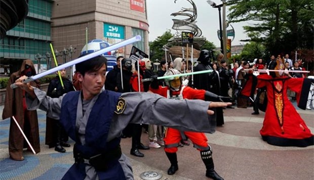 Fans dressed as Star Wars characters react during Star Wars Day in Taipei on Thursday.