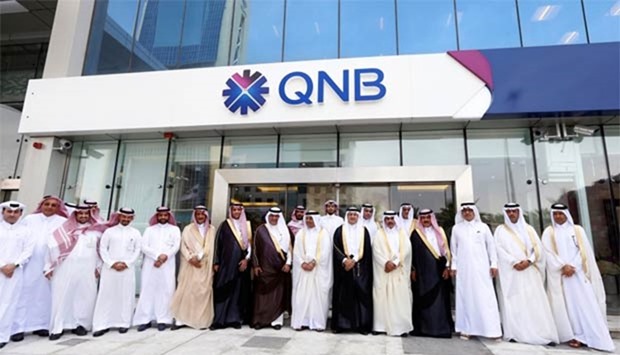Saudi Arabia's central bank governor Ahmed al-Kholifey and Qatar National Bank group chief executive Ali Ahmed al-Kuwari pose for a group photo during the inauguration of QNB's branch in Riyadh on Thursday.