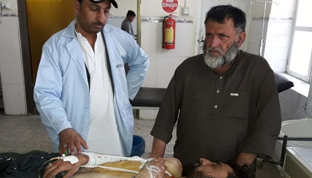 A Pakistani paramedic gives treatment to an injured victim at a hospital following cross border firing in the border town of Chaman.