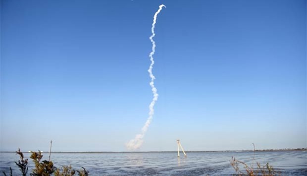 Smoke trails are seen as the Indian Space Research Organisation's GSAT-9 on board the Geosynchronous Satellite Launch Vehicle (GSLV-F09) launches from Sriharikota in Andhra Pradesh on Friday.