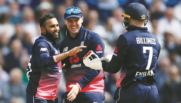 Englandu2019s Adil Rashid (left) celebrates the wicket of Irelandu2019s Stuart Thompson with teammates in Bristol yesterday. (Reuters)