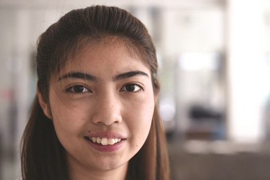 Thai schoolgirl Naruedee Jotsanthia smiles at the Paveena Foundation in Bangkok.