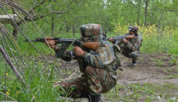 Indian army soldiers take position during an operation against suspected rebels in Turkwangam Lassipora in Shopian south of Srinagar. May 4, 2017 file picture.