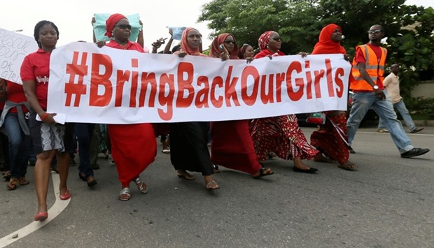 igerians take part in a protest demanding for the release of secondary school girls abducted from the remote village of Chibok, in Asokoro, Abuja May 13, 2014