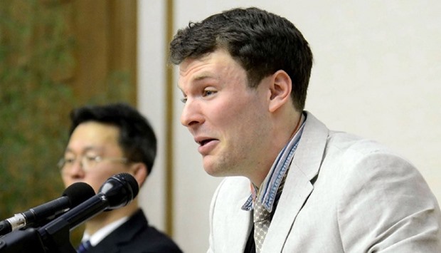 US student Otto Frederick Warmbier (R), who was arrested in North Korea