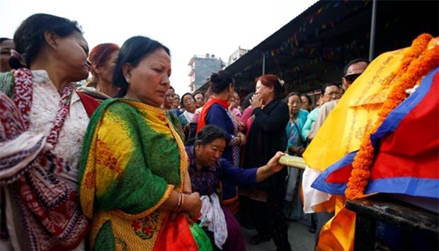 Family members mourn near the body of Min Bahadur Sherchan, who died at Everest base camp, in Kathmandu on Sunday.