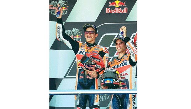 Honda Dani Pedrosa (right) celebrates with teammate and second-placed Marc Marquez on the podium after the Spanish Grand Prix at Jerez de la Frontera race track. (AFP)