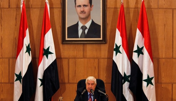 Syria's Foreign Minister Walid al-Moualem speaks during a news conference in Damascus