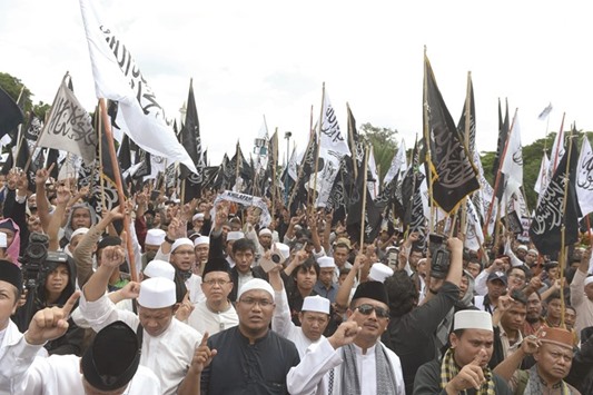 A February 5, 2017, file photo of Indonesian protesters from the Hizb ut-Tahrir holding a demonstration in support of Muslim clerics at the National Monument in Jakarta.