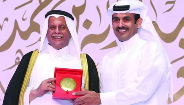 HE al-Attiyah with al-Kaabi, who was acknowledged for his 30-year contribution to the u201cadvancement of the Qatar energy industryu201d, at the 5th anniversary ,Abdullah Bin Hamad Al-Attiyah International Energy Awards, for lifetime achievement in Doha on Monday. Picture: Jayan Orma