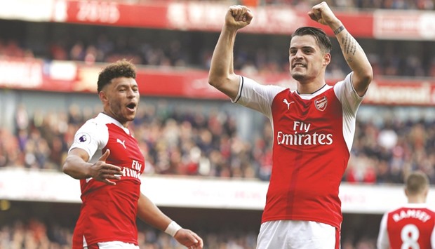 Arsenal midfielder Granit Xhaka (right) scored one of the goals in the 2-0 win against Manchester United on Sunday. (AFP)