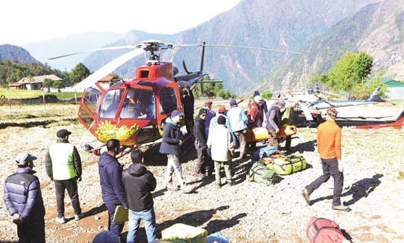 Official carry the body of Min Bahadur Sherchan brought to Lukla helipad on Saturday.