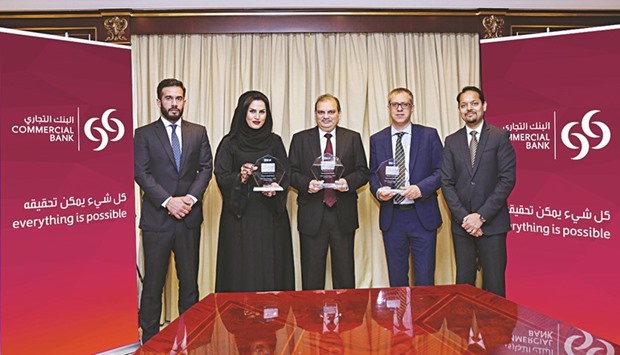 Commercial Bank officials with the u2018Best New Product in Qatar for 2016u2019 award from Visa.
