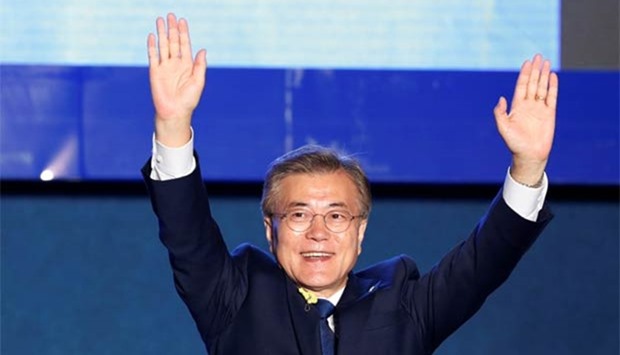 South Korea's president-elect Moon Jae-in celebrates in Seoul on Tuesday.