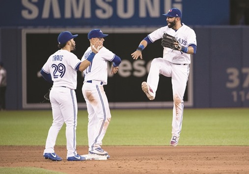 Toronto Blue Jays players celebrate the win over Cleveland Indians.