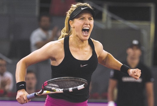 Eugenie Bouchard of Canada celebrates her victory over Maria Sharapova of Russia in Madrid. (Reuters)
