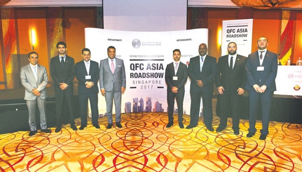 QFC officials in Singapore.