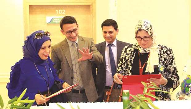 Dhouha Ammar Hamdani and Dr Nahla Hassan Sharaf evaluating a poster competition related to World Hand Hygiene Day,  at Aster Hospital, Doha.
