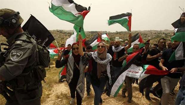 Palestinians rally near the separation fence between Jerusalem and Bethlehem, ahead of commemorations marking the 70th anniversary of the Nakba on Thursday.