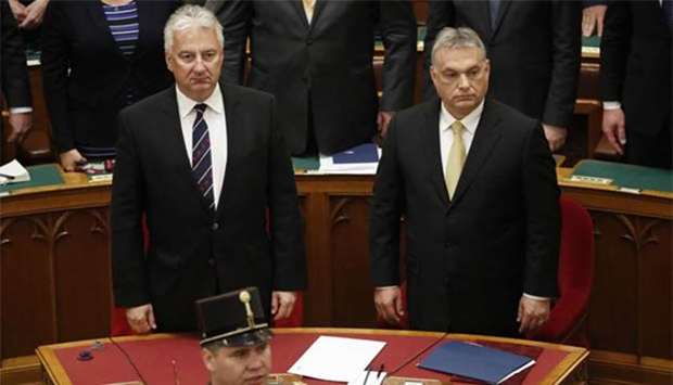 Hungarian Prime Minister Viktor Orban reacts after taking the oath of office next to Zsolt Semjen, Deputy Prime Minister, in the Parliament in Budapest on Thursday.