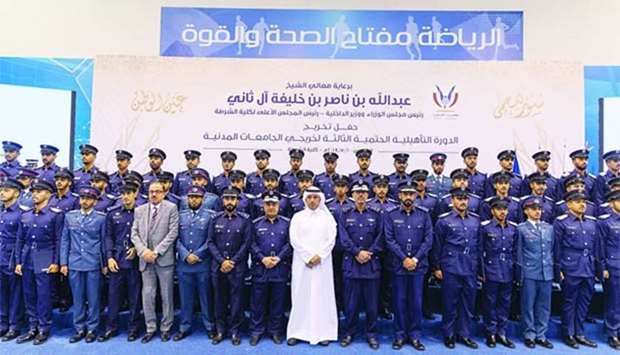 HE the Prime Minister and Interior Minister Sheikh Abdullah bin Nasser bin Khalifa al-Thani with the graduates and officials of the Police College.