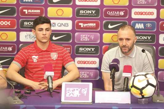 Duhail coach Djamel Belmadi (right) speaks to the media during a press conference yesterday as Duhail player Bassam al-Rawi looks on. PICTURES: Othman Iraqi