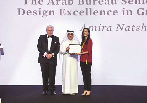 AEBu2019s Group CEO and chief architect Ibrahim Mohamed Jaidah presented an award to graduating student Amira Natsheh as VCUarts Qatar executive dean Donald N Baker looks on.