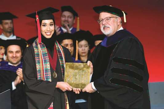 CMU-Q dean Michael Trick and Boshra al-Sulaiti.