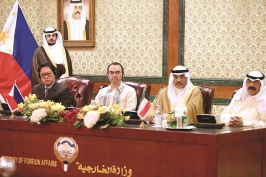 (From left) Philippine secretary of labour Silvestre Bello, Foreign affairs secretary Alan Peter Cayetano, Kuwaiti foreign minister Sheikh Sabah al-Khaled al-Sabah and Kuwaiti foreign ministry undersecretary Khaled al-Jaralla hold a press conference after signing an agreement to regulate domestic workers, at the foreign ministry in Kuwait City, yesterday.