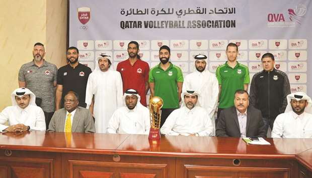Qatar Volleyball Association (QVA) officials, Al Rayyan and Al Ahli coaches and players pose with the trophy at a press conference ahead of todayu2019s Amir Cup Volleyball final. PICTURE: Noushad Thekkayil