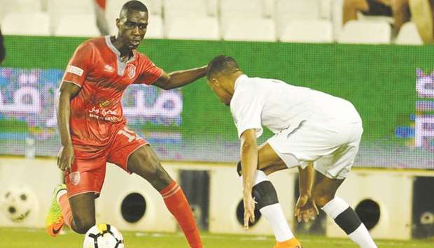 Al Duhailu2019s Almoez Ali (left) in action during the Amir Cup semi-final against Al Sadd at Jassim Bin Hamad Stadium in Doha yesterday. PICTURES: Shemeer Rasheed and Jayan Orma