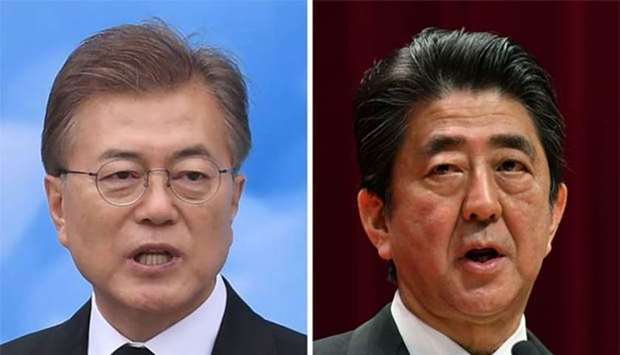 South Korea's President Moon Jae-in (left) and Japan's Prime Minister Shinzo Abe.