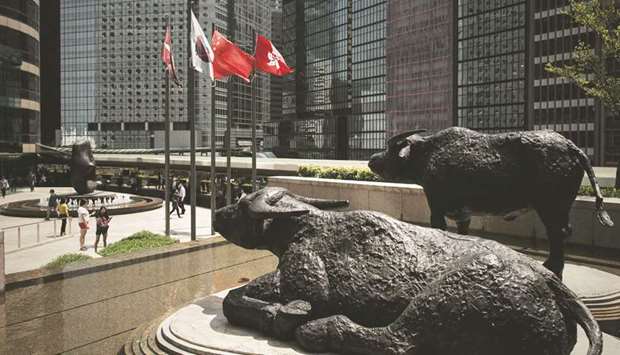Bull statues displayed outside the Hong Kong Stock Exchange. The Hang Seng closed up 1.0% to 31,122.06 points yesterday.