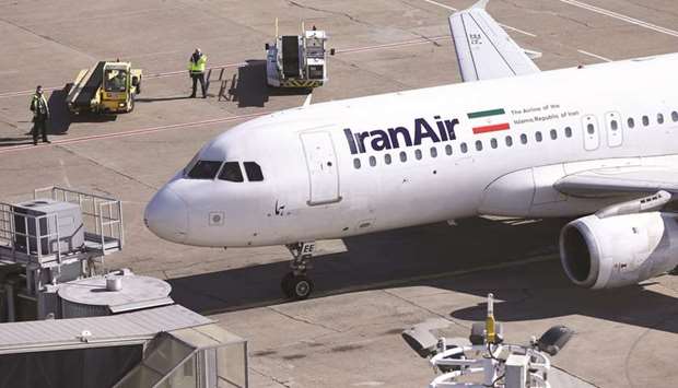 An IranAir Airbus A320 aircraft parks after landing at Belgradeu2019s Nikola Tesla Airport, Serbia. The airline had ordered 200 passenger aircraft, with 100 from Airbus, 80 from Boeing and 20 from ATR.