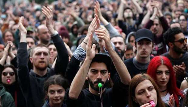 Protesters attend a rally against the Georgian authorities' anti-drug policy following the recent police raids at several local nightclubs near the building of parliament in Tbilisi on Saturday.
