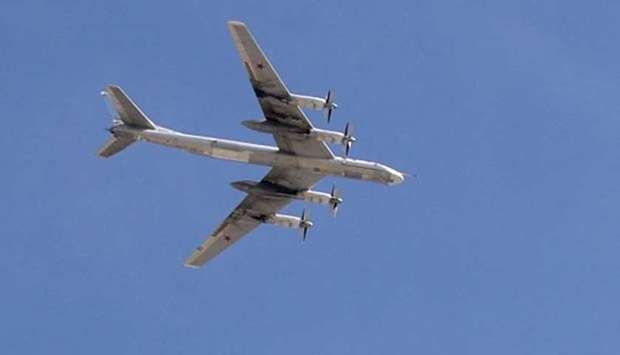 A Russian Tupolev Tu-95 strategic bomber flies above Moscow's Red Square. File picture