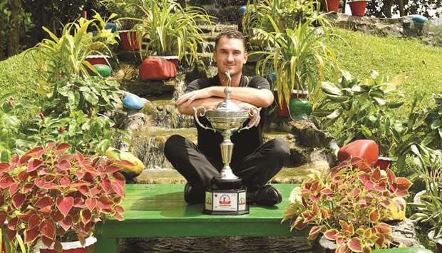 Malcolm Kokocinski of Sweden with the trophy after winning the Bangladesh Open at the Kurmitola Golf Club in Dhaka yesterday. (AFP)