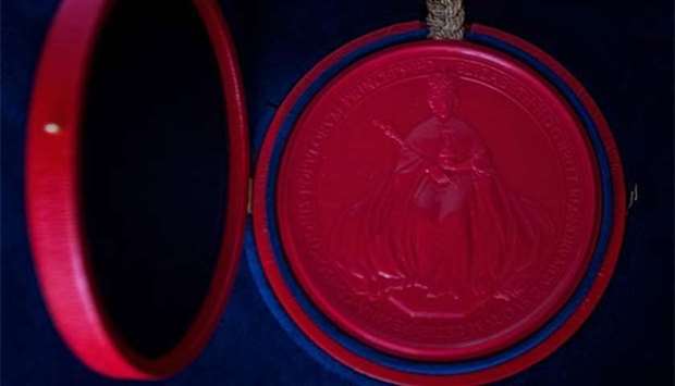 A picture taken at Buckingham Palace in London on April 12 shows the Great Seal of the Realm sealing the Instrument of Consent, an official State document that records the Queen's formal consent to Prince Harry's forthcoming marriage to Meghan Markle.