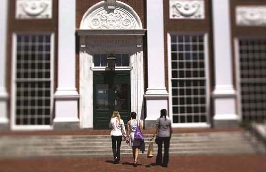 Students walk on the campus at Harvard Business School in Boston (file). Harvard University is trying to sell some of its timberland investments in South America to investors who will share management of the portfolio as the  endowment retreats from bets on natural resources.